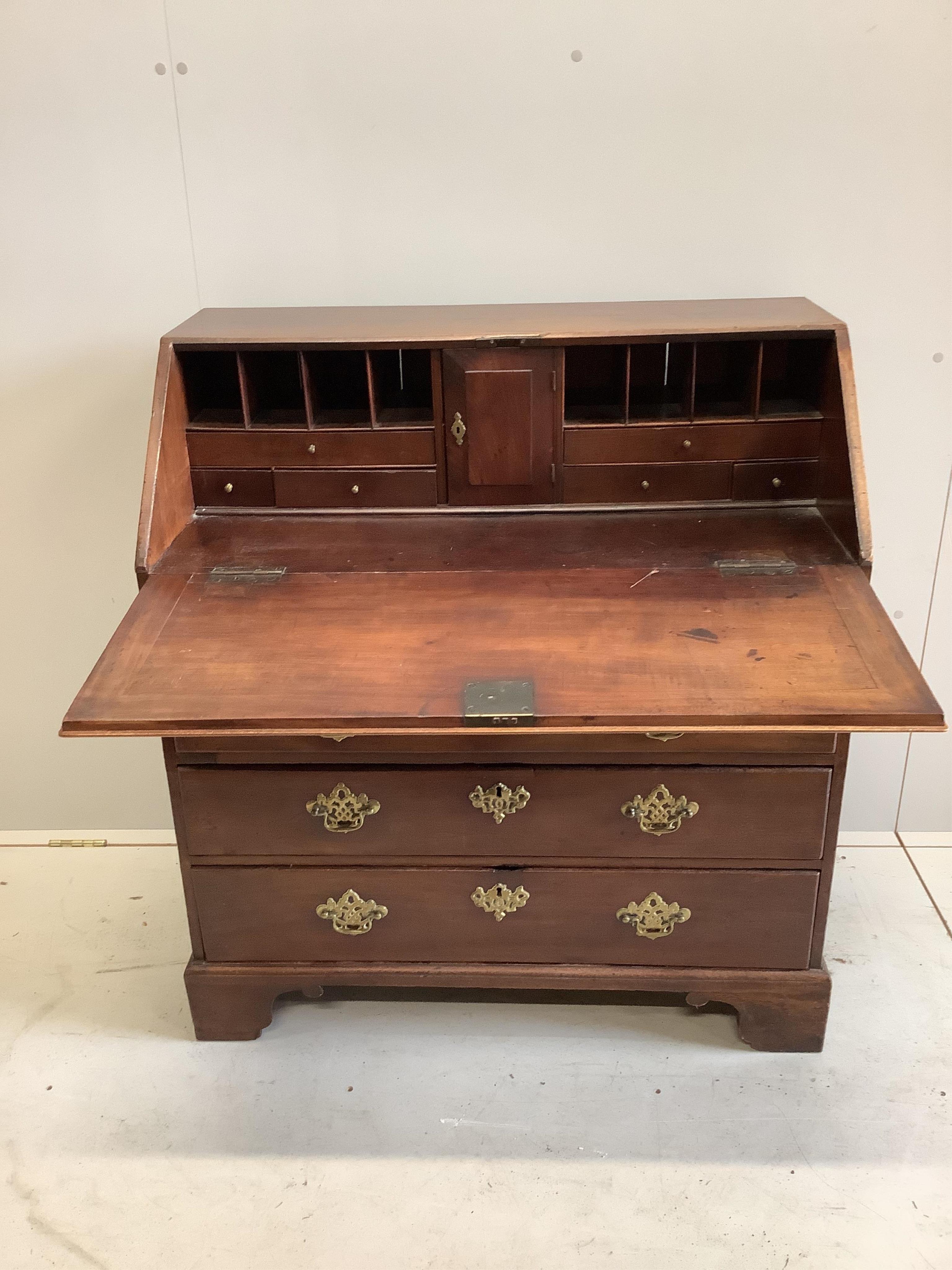 A George III mahogany bureau, width 90cm. Condition - fair to good, but faded at the top